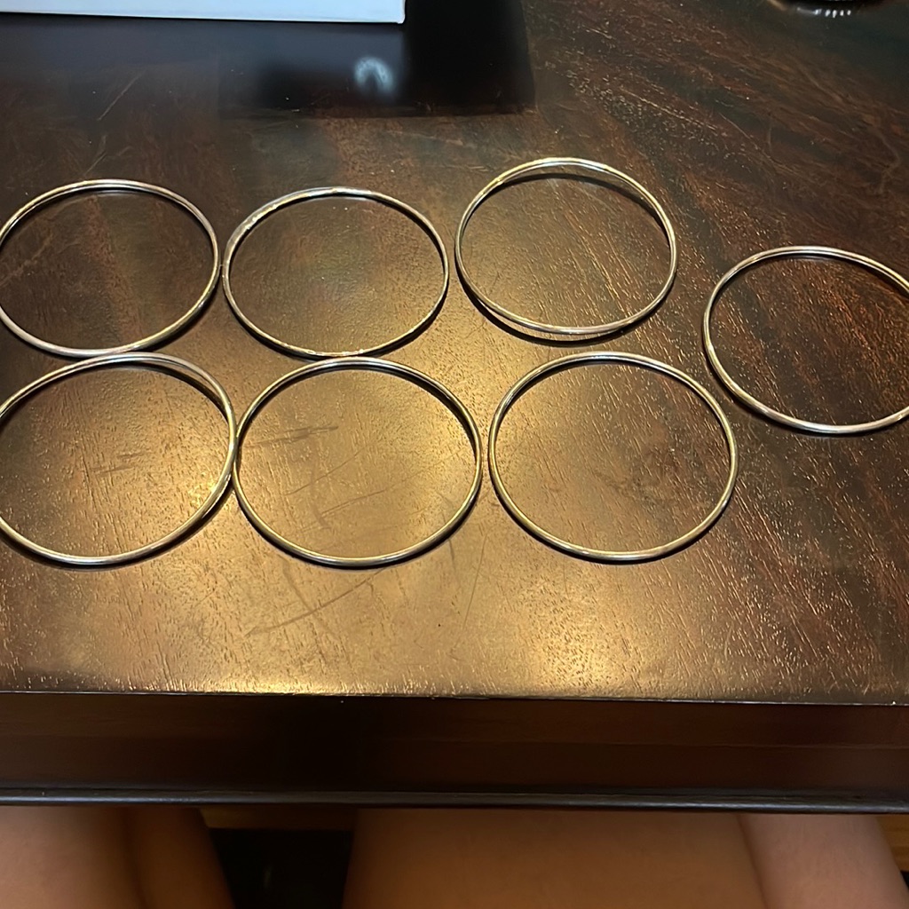 7 Silver Bracelets.